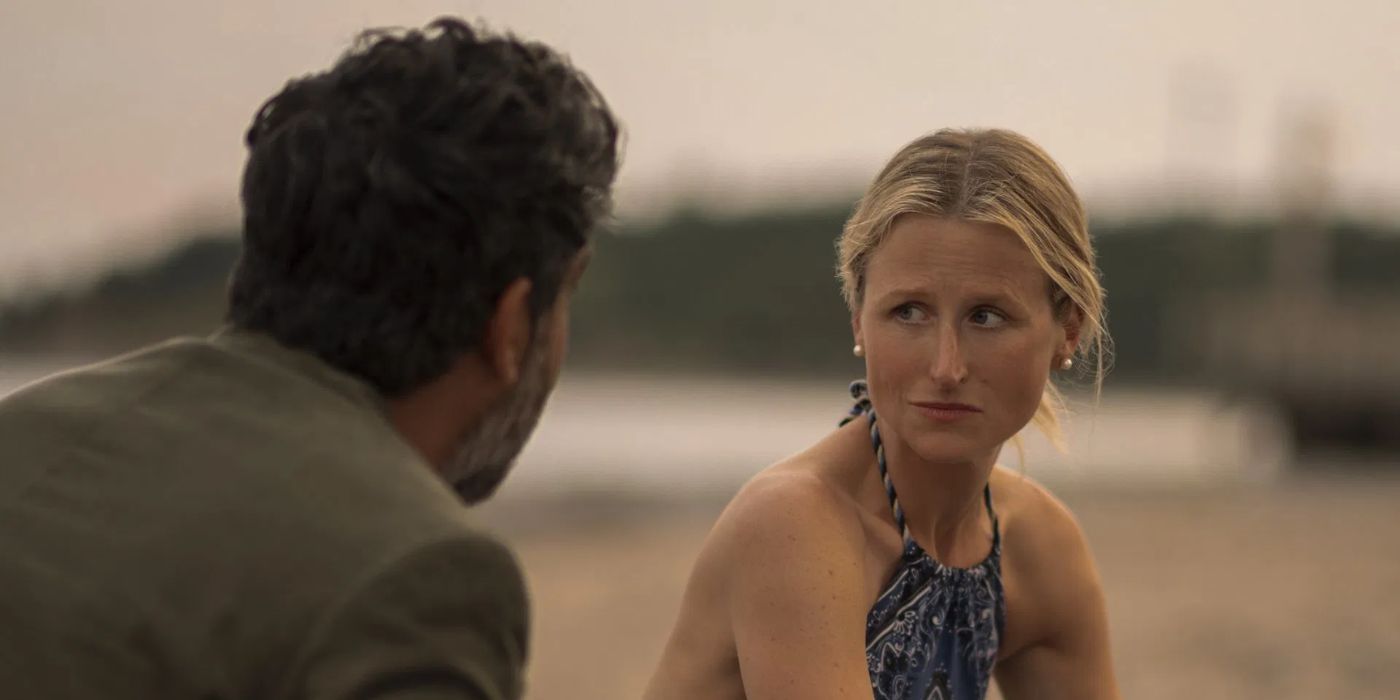 Mamie Gummer as Carrie Sinclair having a serious conversation with someone on a beach in 'We Were Liars'.