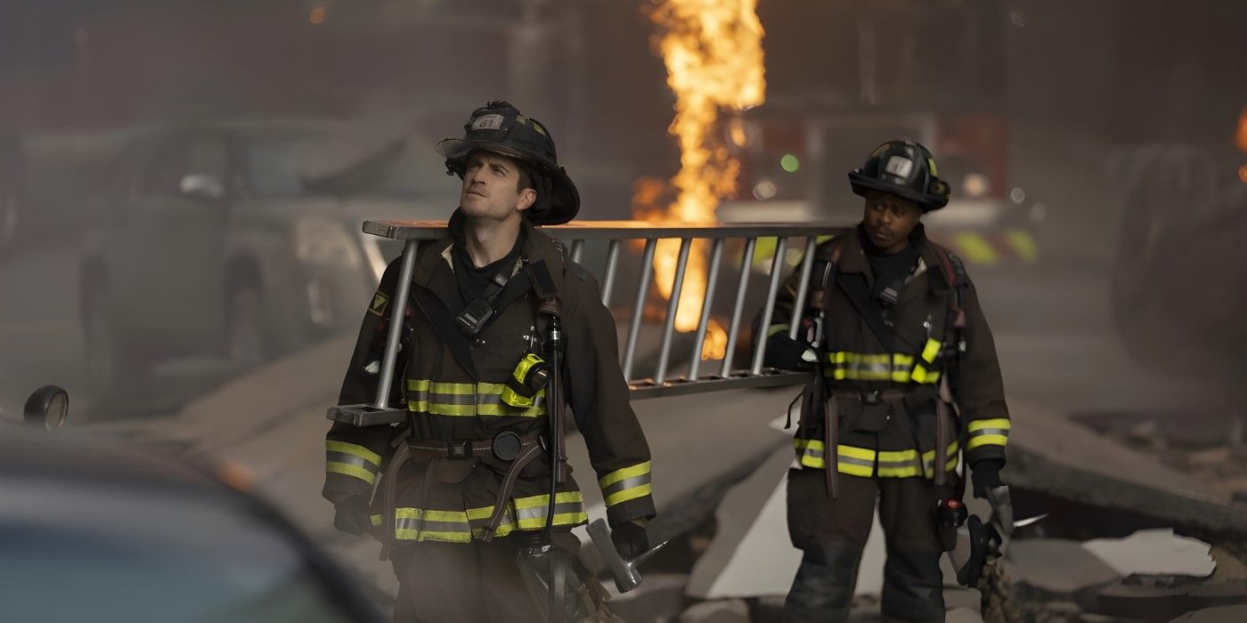 Carver (Jake Lockett) and Ritter (Daniel Kyri) carry a ladder through the rubble in the Chicago Fire episode "In the Trenches, Part I."