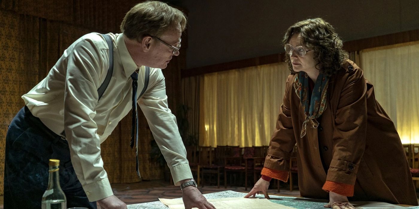 Valery (Jared Harris) and Ulana (Emily Watson) bent over a map in 'Chernobyl.'
