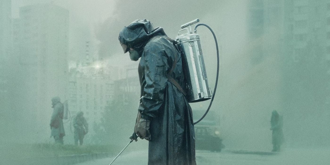 Person in a radioactive suit spraying a chemical in a foggy background in 'Chernobyl.'