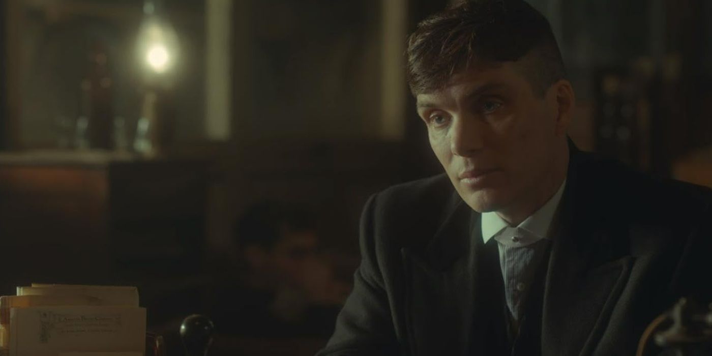 Cillian Murphy, wearing a suit and looking at something, in 'Peaky Blinders' Season 2, Episode 6 