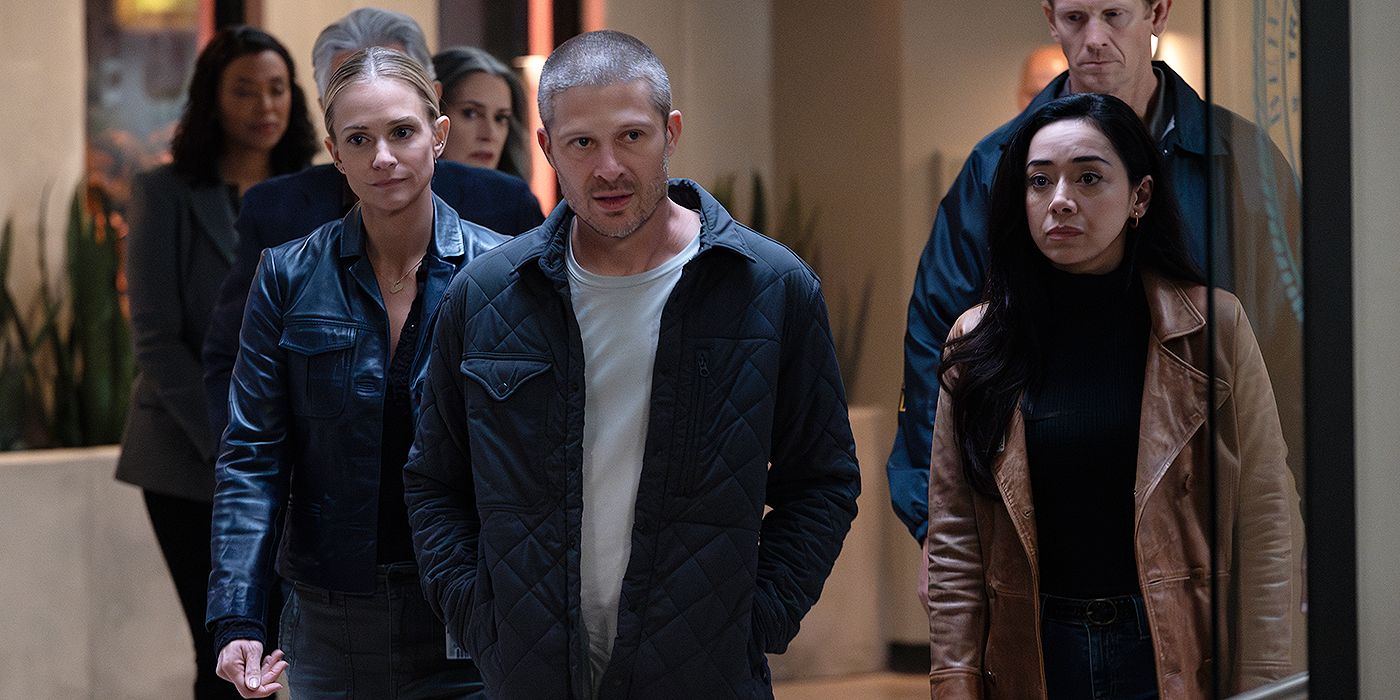 Voit (Zach Gilford) walking with J.J. (A.J. Cook) and Dr. Ochoa (Aimee Garcia) through the BAU in Criminal Minds