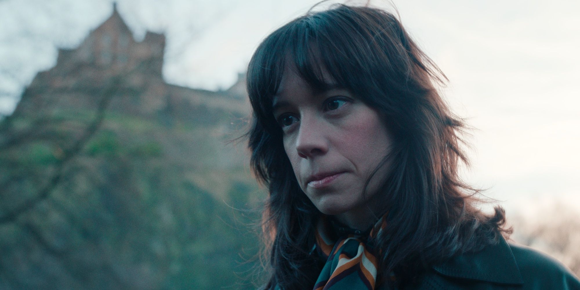 Chloe Pirrie as Merritt Lingard standing outside looking serious in Dept. Q