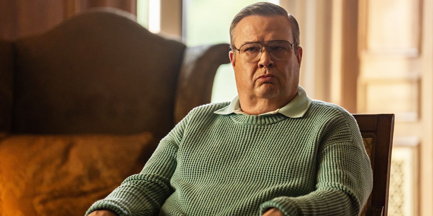 Eric Stonestreet sitting in a chair with a concerned expression in Dexter: Resurrection