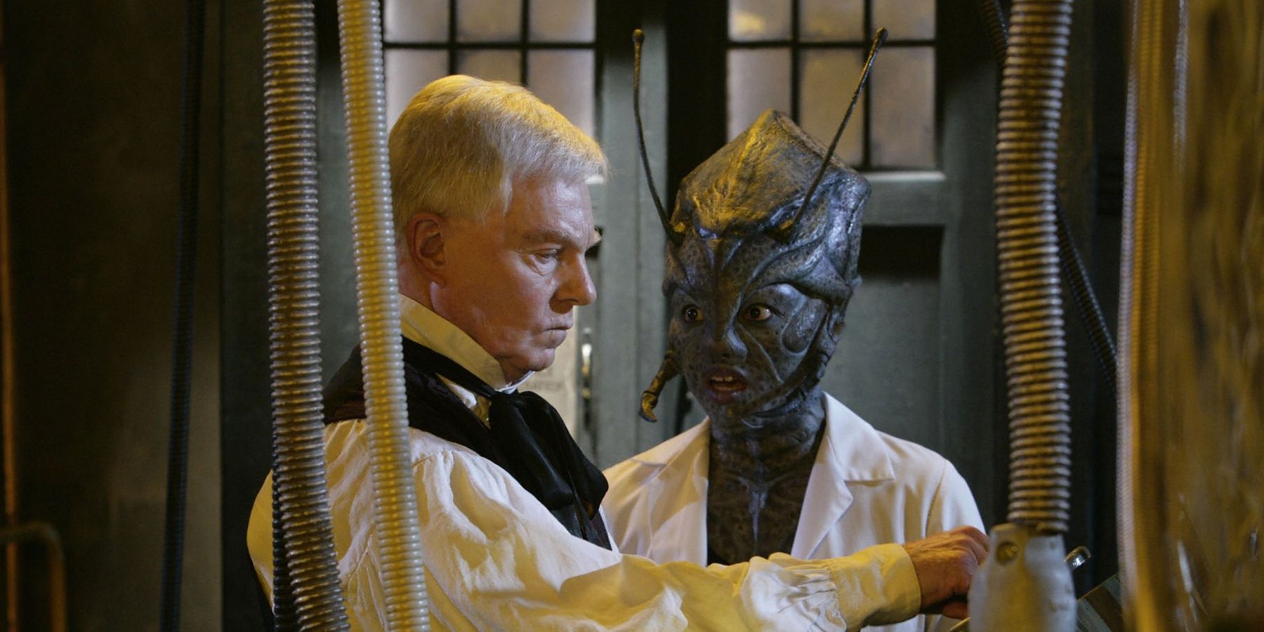Derek Jacobi and Chippo Chung having a tense conversation in Doctor Who episode "Utopia".