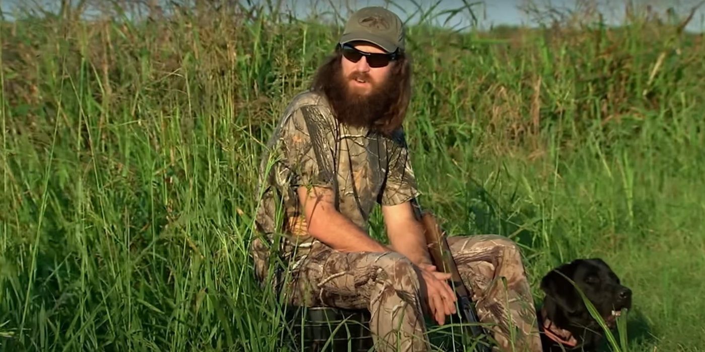 Jase Robertson fron duck dynasty sitting in a field during a duck hunt