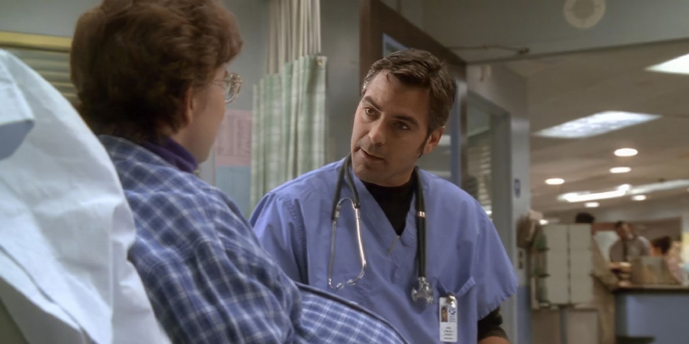 George Clooney in ER, wearing scrubs and speaking to a woman in a hospital bed.
