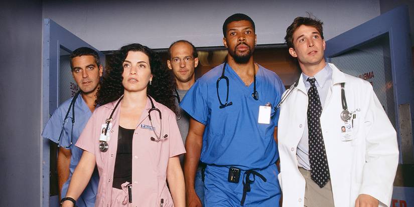The original cast of ER walking down a hospital hallway in ER.