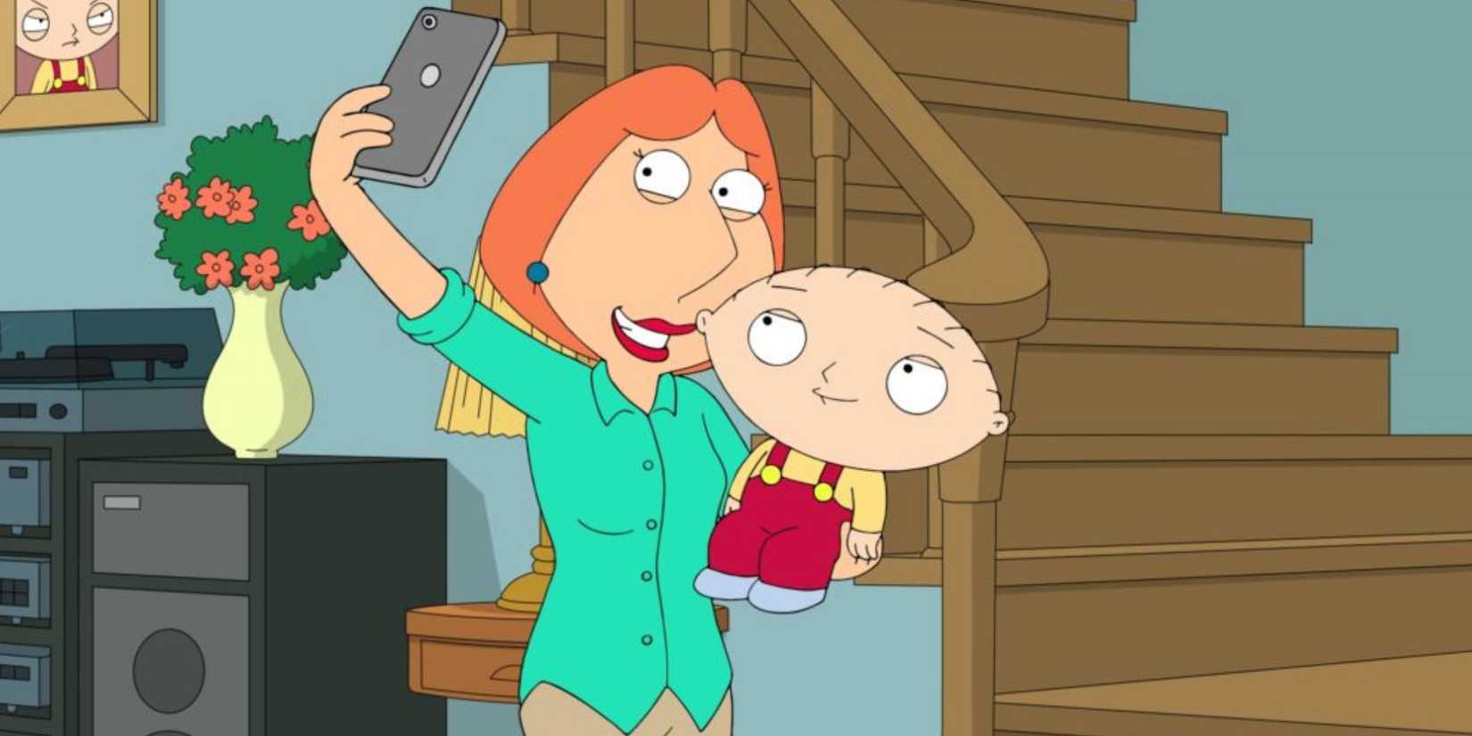 Lois holding Stewie and taking a selfie with him in Family Guy episode Stewie's First Word