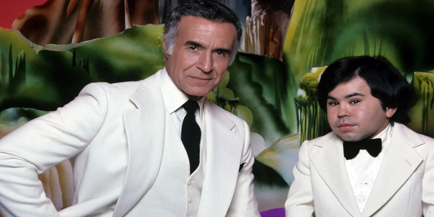 Mr. Roarke and Tattoo stand next to one in white suits in Fantasy Island.