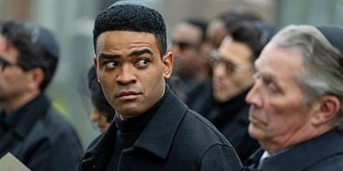 Owen Thiele as Anton looking to the side in a crowd at his therapist's funeral in Adults.