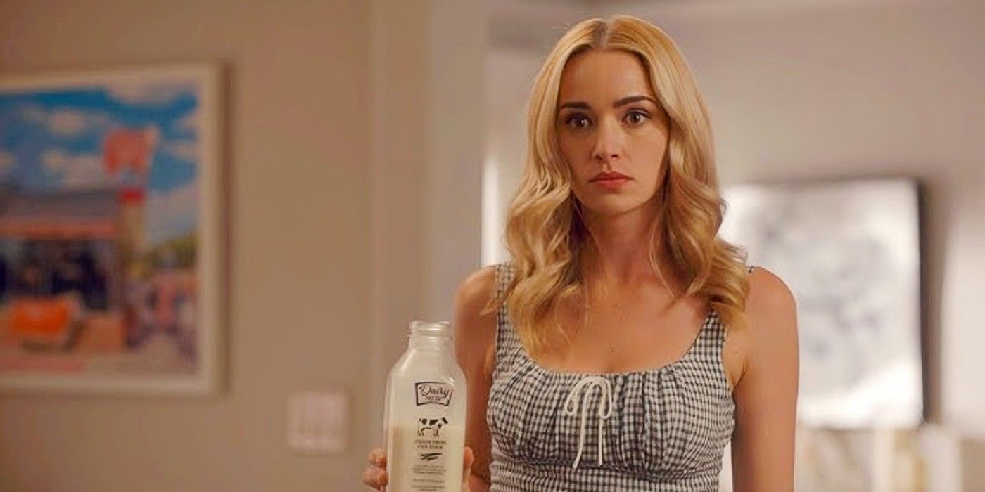 Brianne Howey as Georgia Miller holding a bottle of milk in the Season 3 finale of Ginny and Georgia.