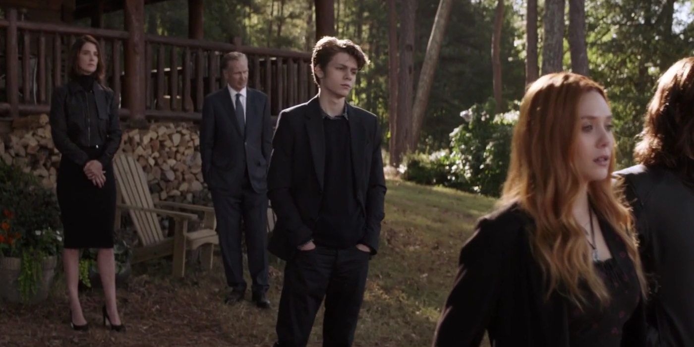 Harley Keener (Ty Simpkins) in a black suit at a memorial service for Tony Stark in Avengers Endgame.