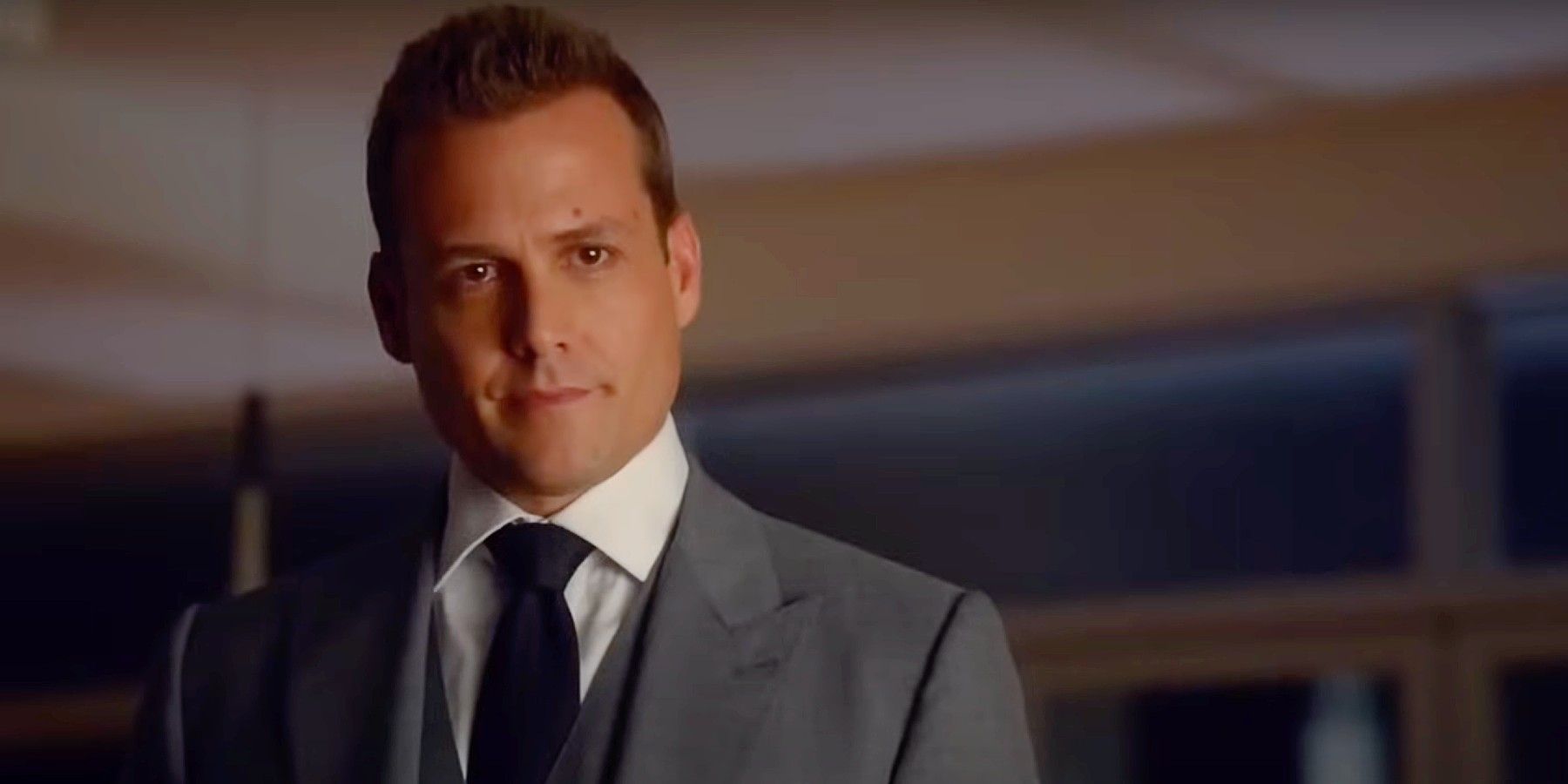 Harvey Specter gives Donna, who is off-camera, a hopeful and loving look in Suits Season 5.