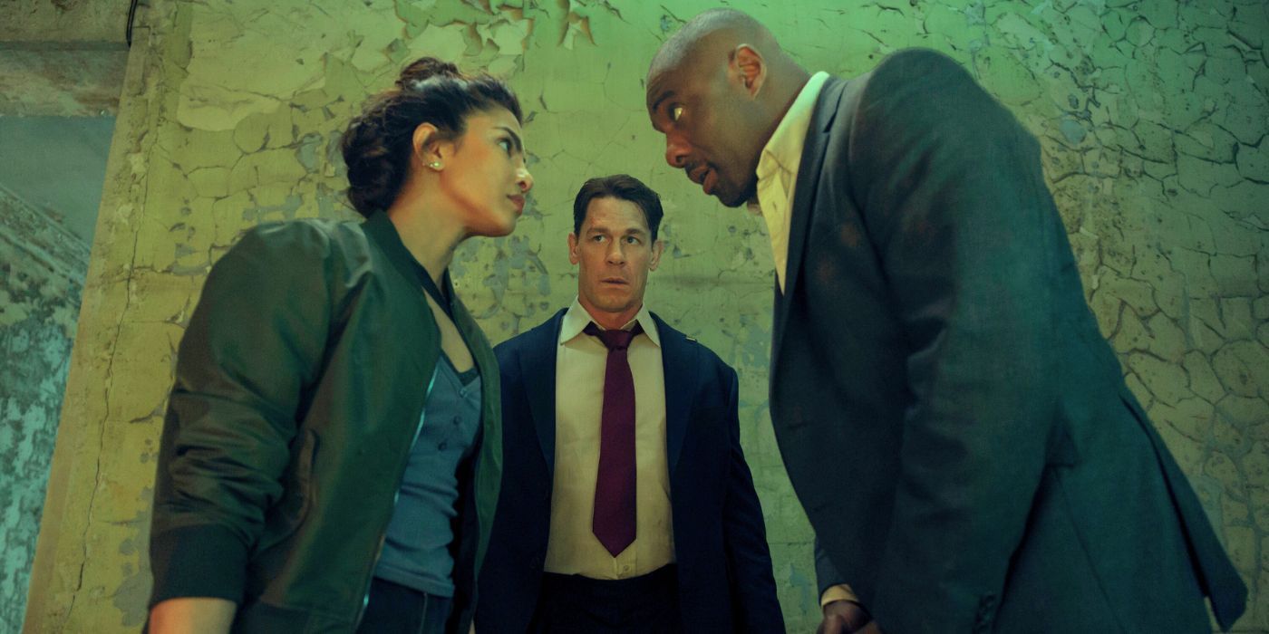 John Cena standing in between Priyanka Chopra-Jonas and Idris Elba in Heads of State.