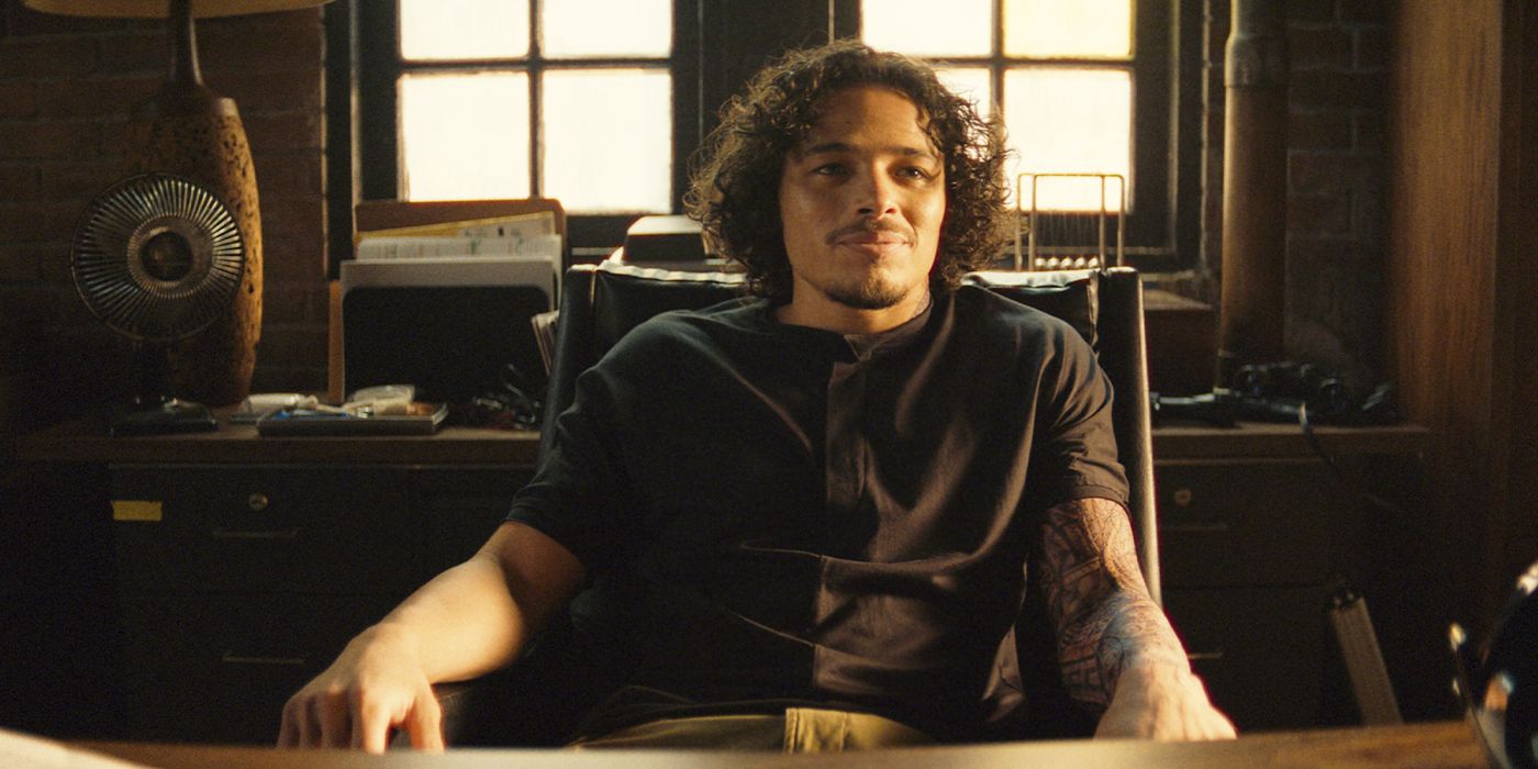 Parker sitting back in a chair at a desk in an office