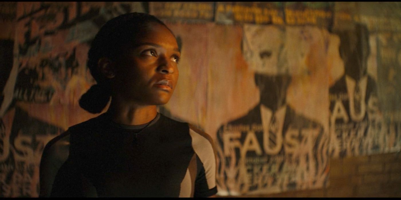 Riri Williams (Dominique Thorne) in front of a Faust poster that may foreshadow Mephisto in Ironheart.