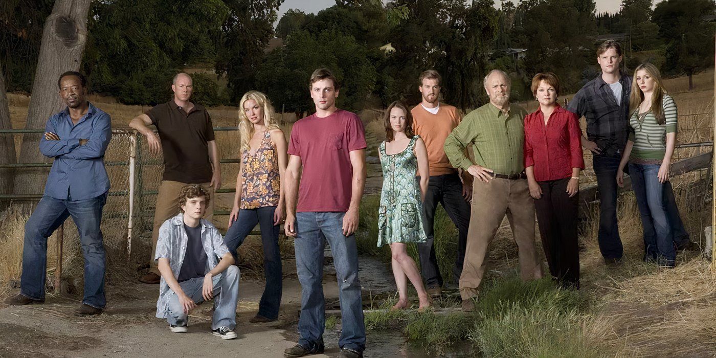 The cast of Jericho stand outside and look at the camera in a promo photo.
