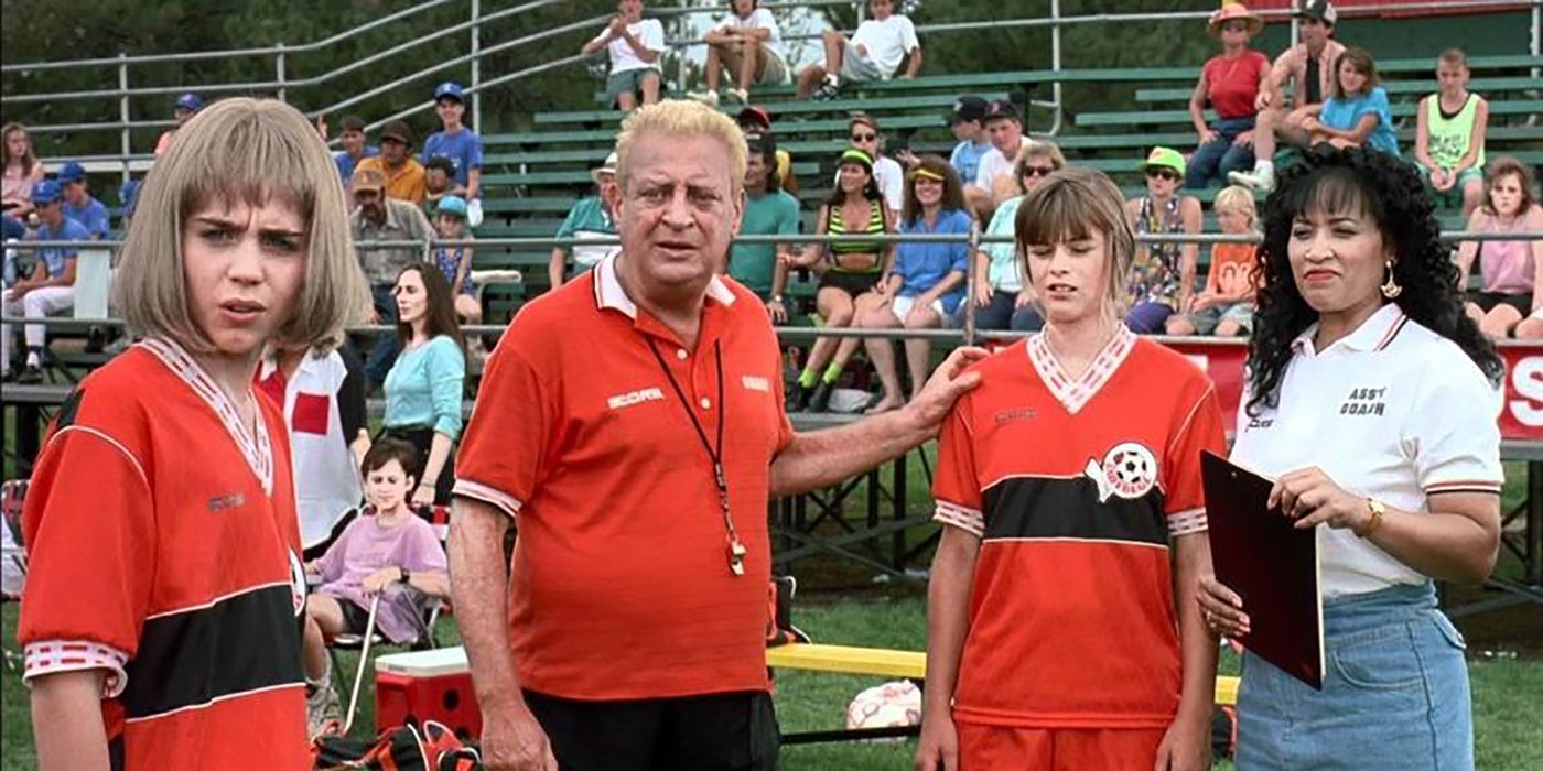 A coach and assistant coach with two soccer team members in Ladybugs.