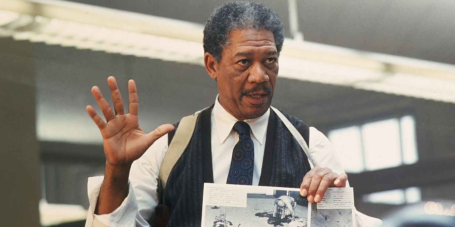 Actor Morgan Freeman as Somerset, holding up a piece of evidence and his hand in Se7en