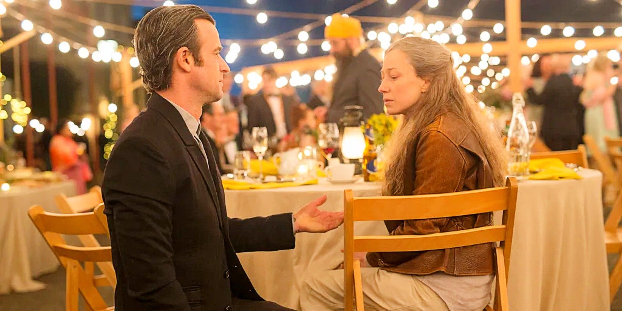 Older versions of Justin Theroux as Kevin Garvey and Carrie Coon as Nora Durst at a wedding together in the series finale of The Leftovers