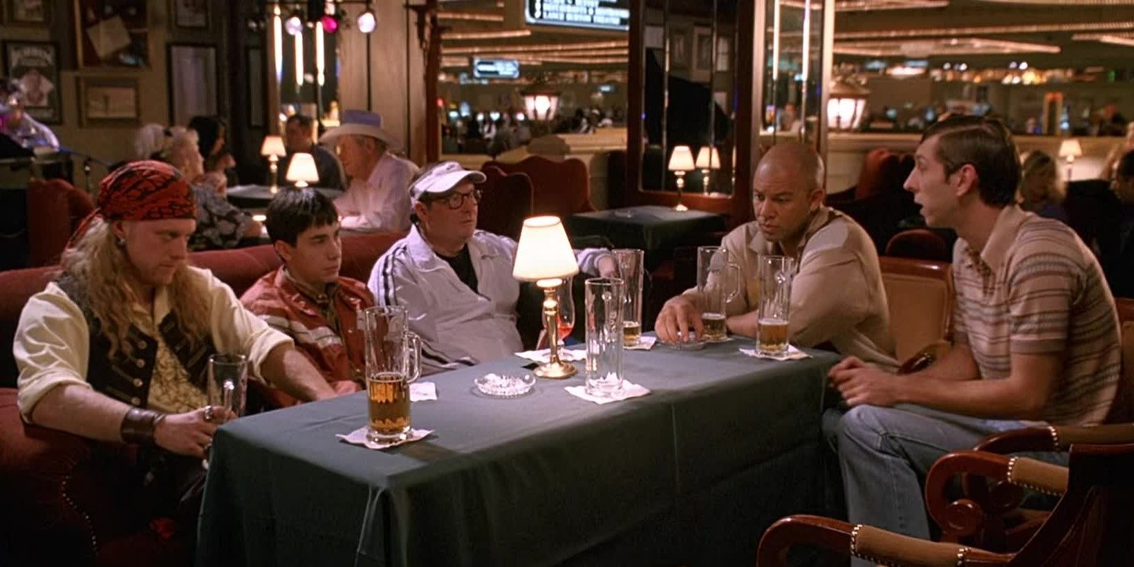 The cast sit around a table in a restaurant and look sad in Dodgeball: A True Underdog Story.