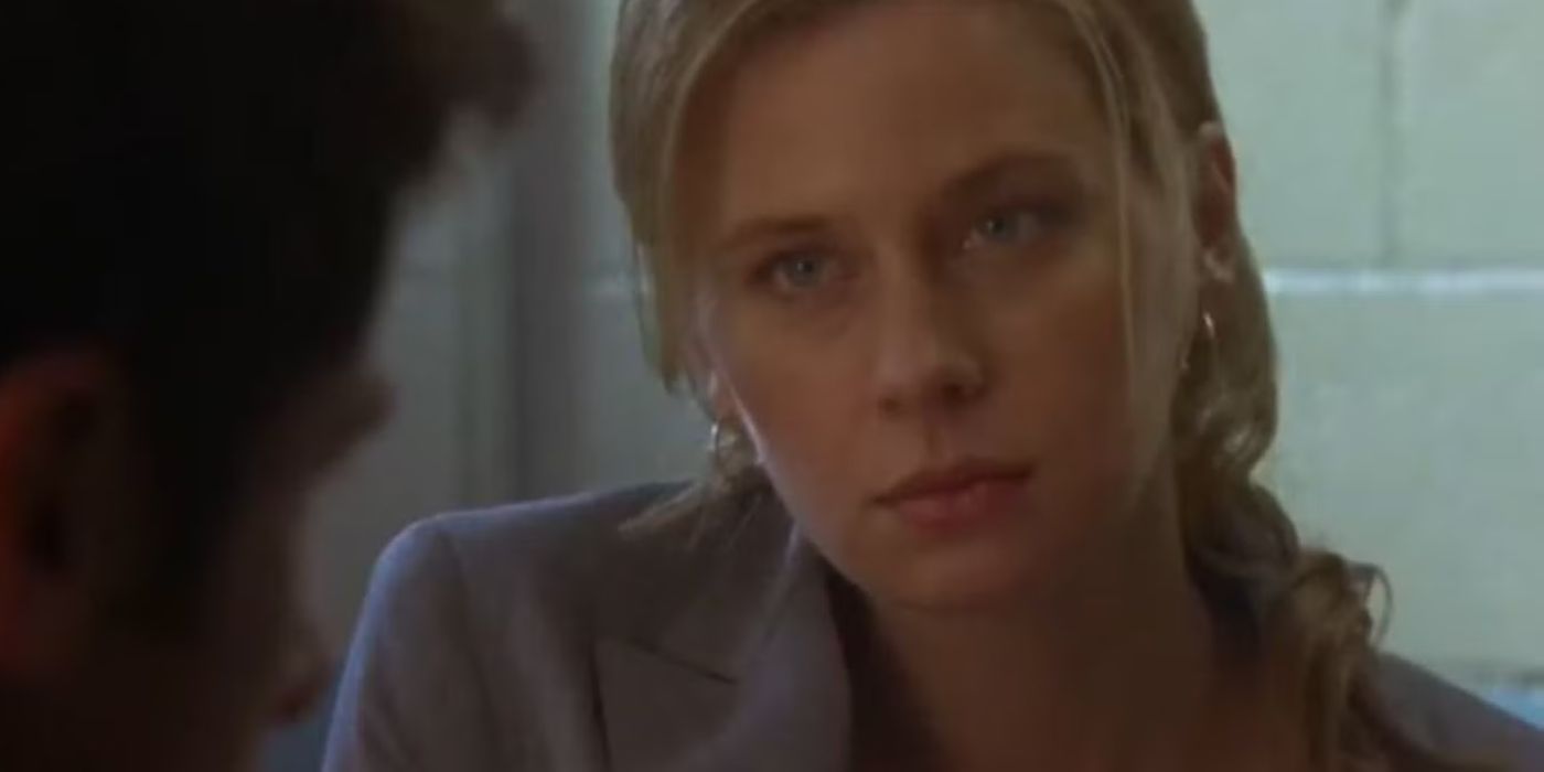 Anne Dudek as Lucinda Barry staring at someone across from her in the pilot of 'Psych.'