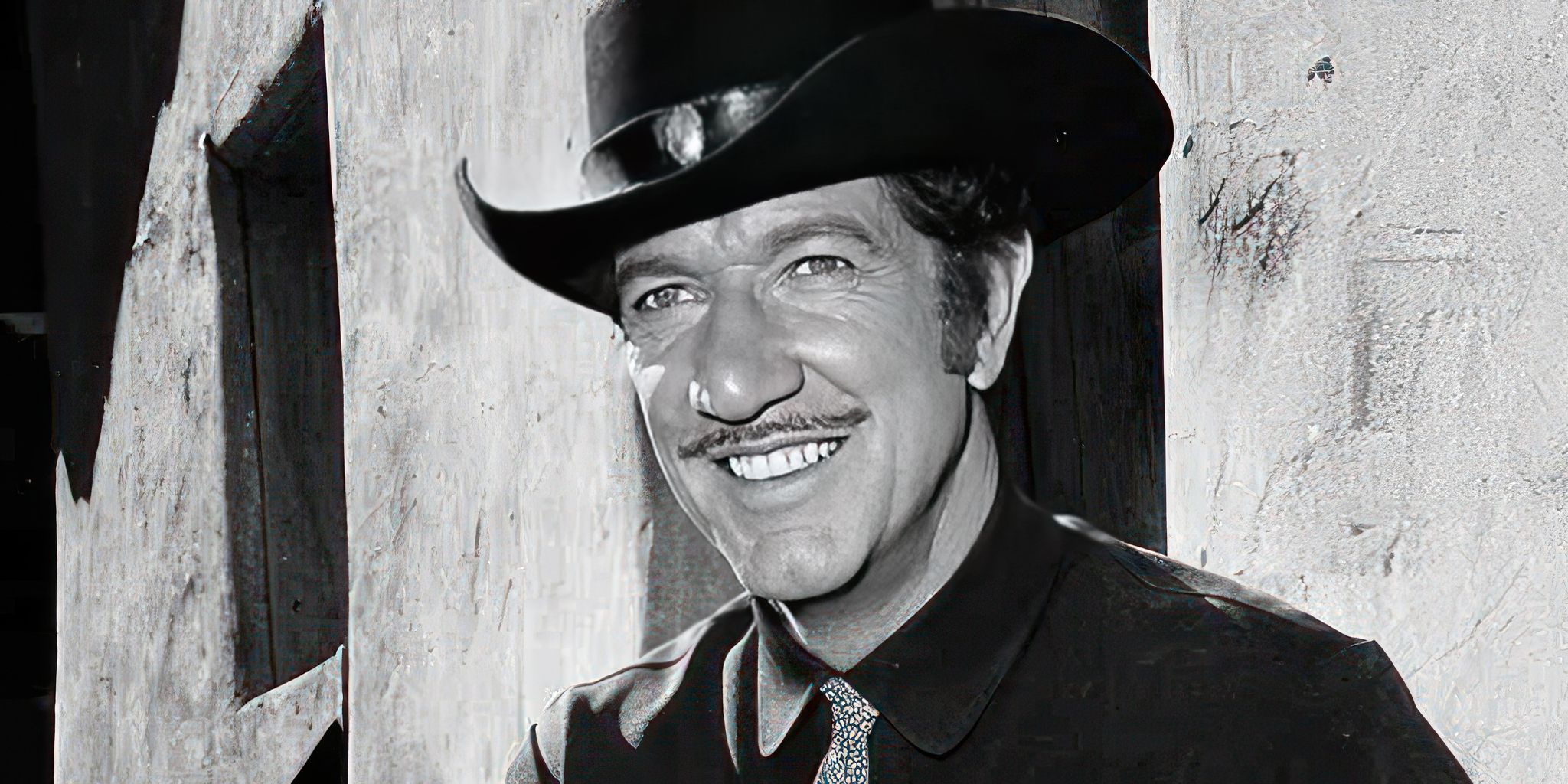 Richard Boone sorrindo, tem arma - vai viajar