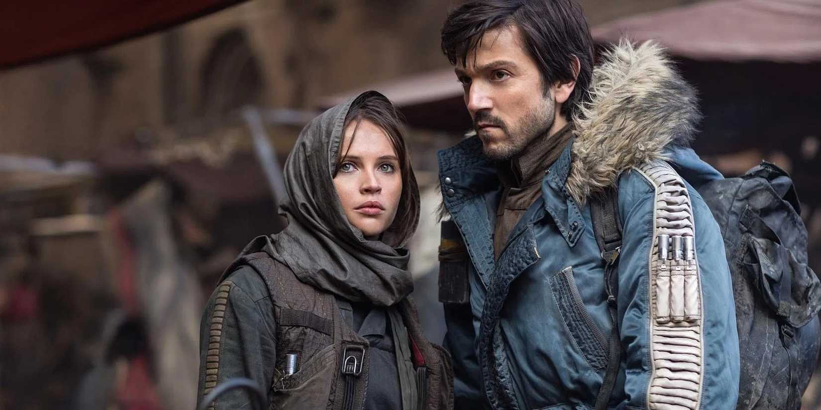 Jyn Erso and Cassian Andor looking to the distance in Rogue One: A Star Wars Story