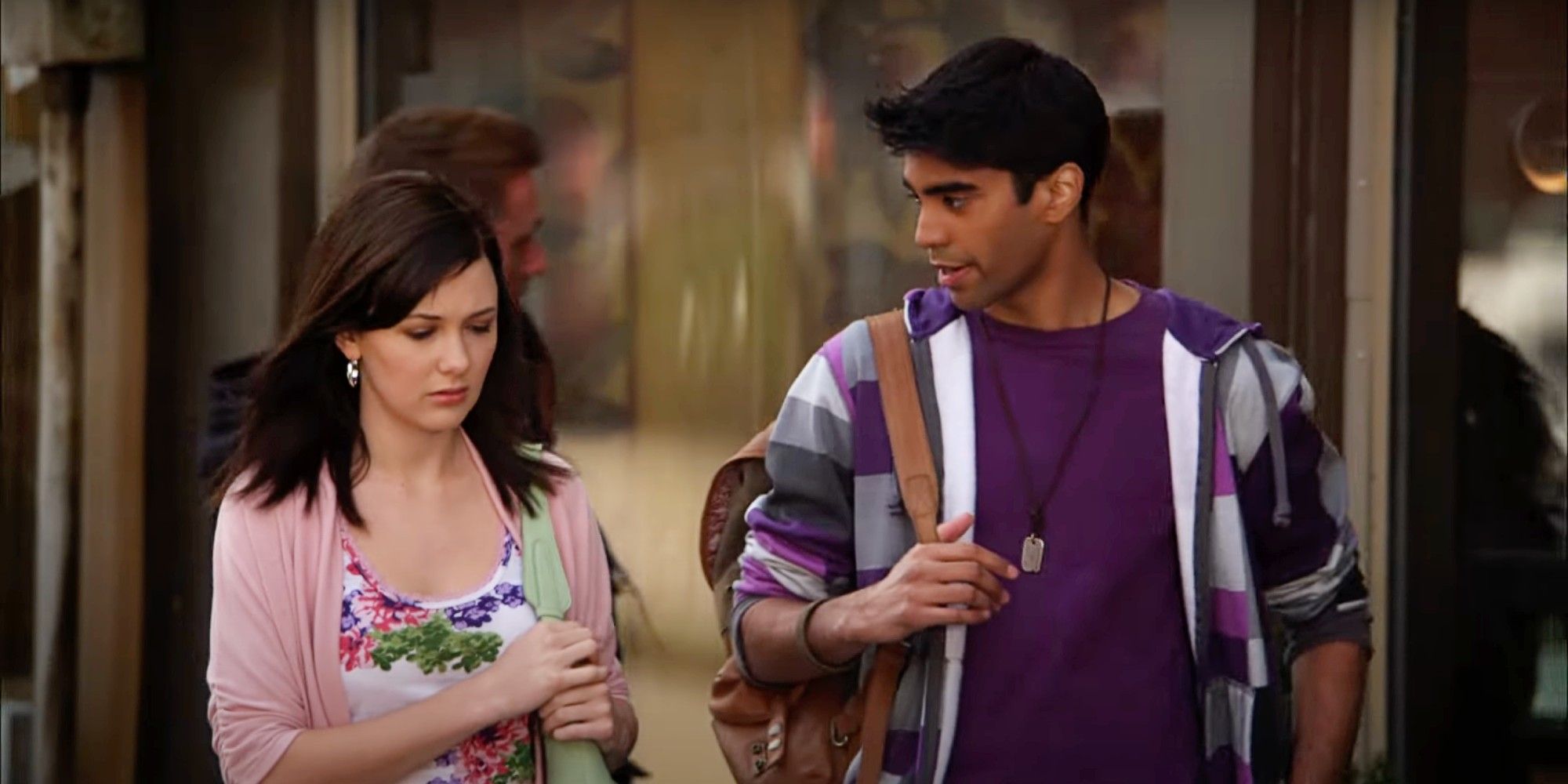 Samantha Munro as Anya and Raymond Ablack as Sav walk on a street in Degrassi: The Next Generation Season 10.