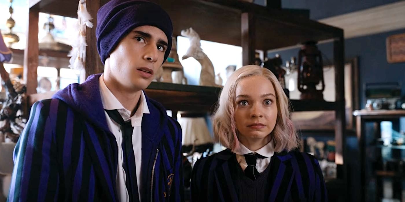 Ajax (Georgie Farmer) and Enid (Emma Myers) stand inside a taxidermy shop in Season 1 of Wednesday.