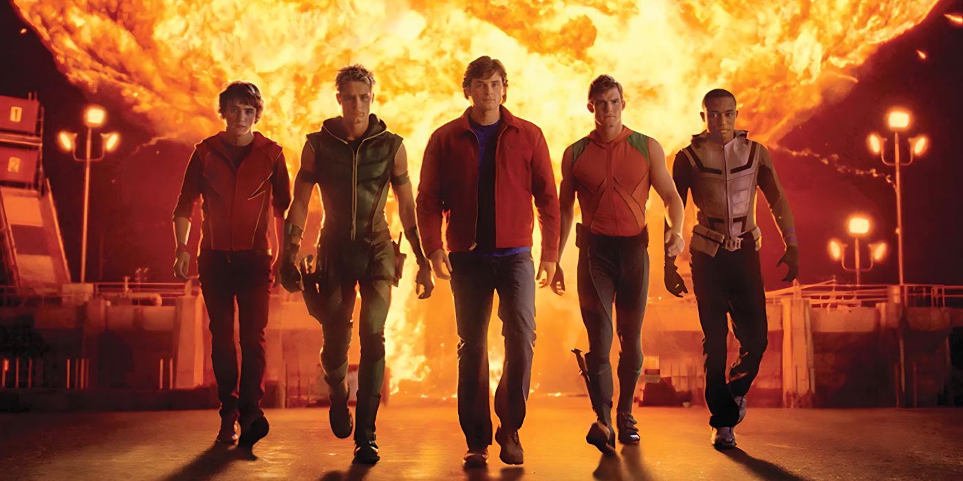 Bart Allen, Oliver Queen, Clark Kent, Arthur Curry, and Victor Stone walking away from an explosion in Smallville