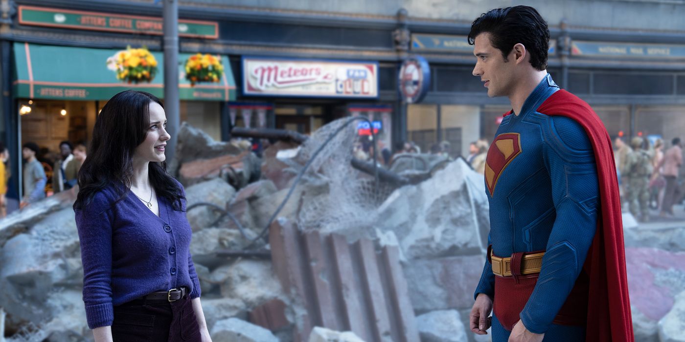 Lois Lane and Superman smiling at each other on the street in Superman