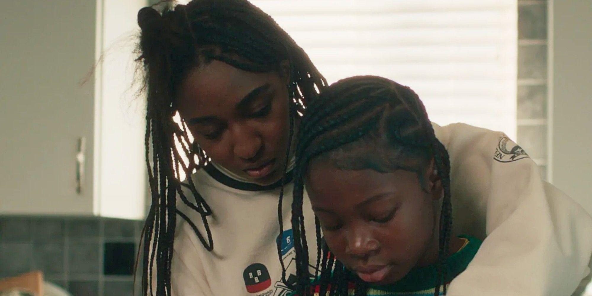 Sydney Adamu standing with her niece, TJ, in The Bear Season 4.