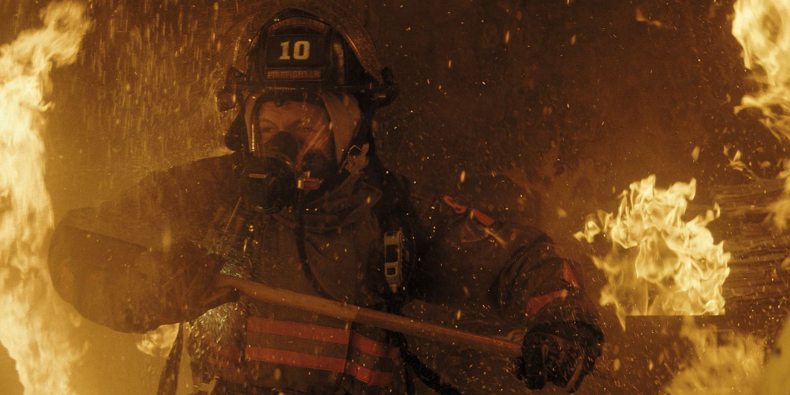 Dave Gunsen in a firefighter attire inside a fire in Smoke