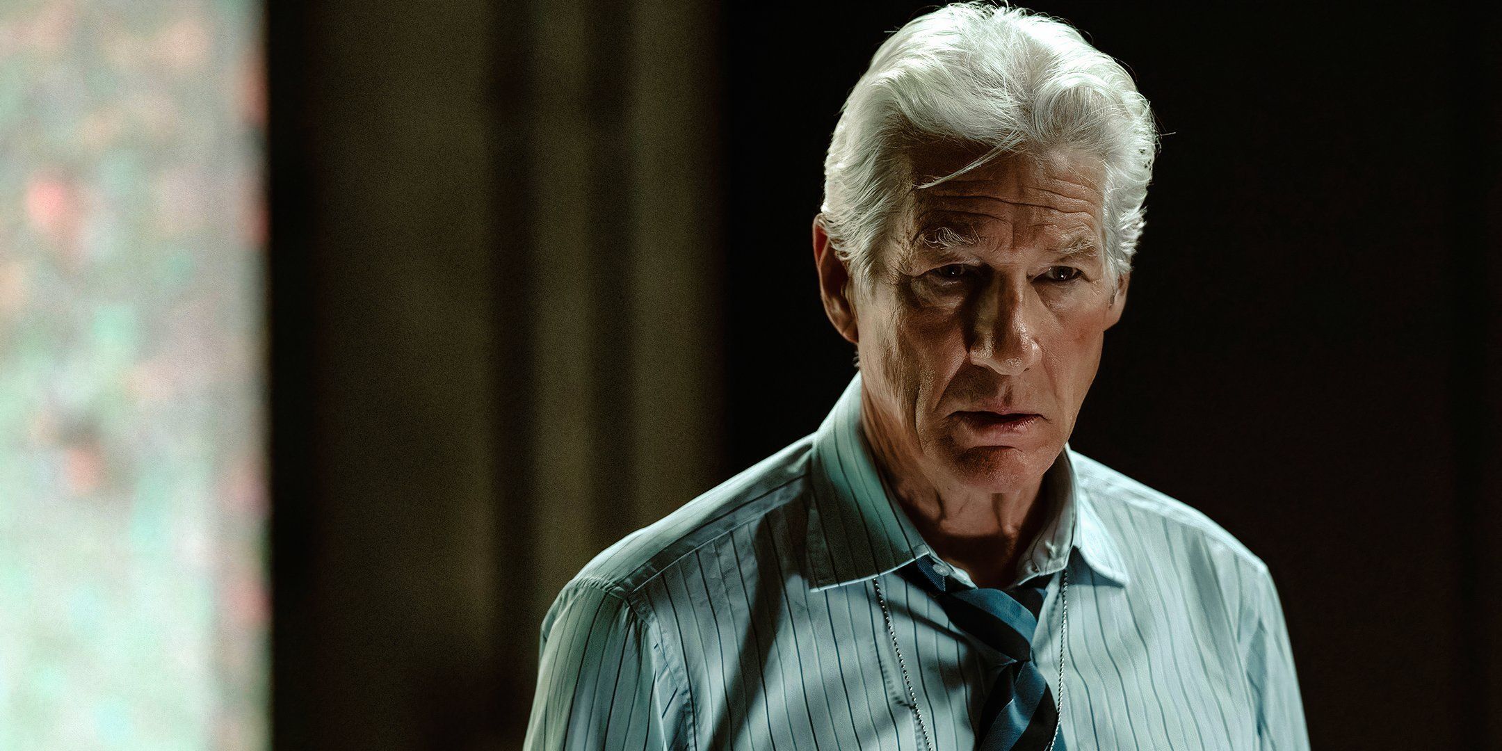 Richard Gere with his head down in The Agency.