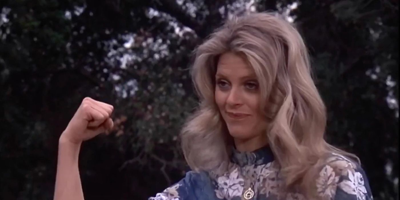 The Bionic Woman flexing her arm.