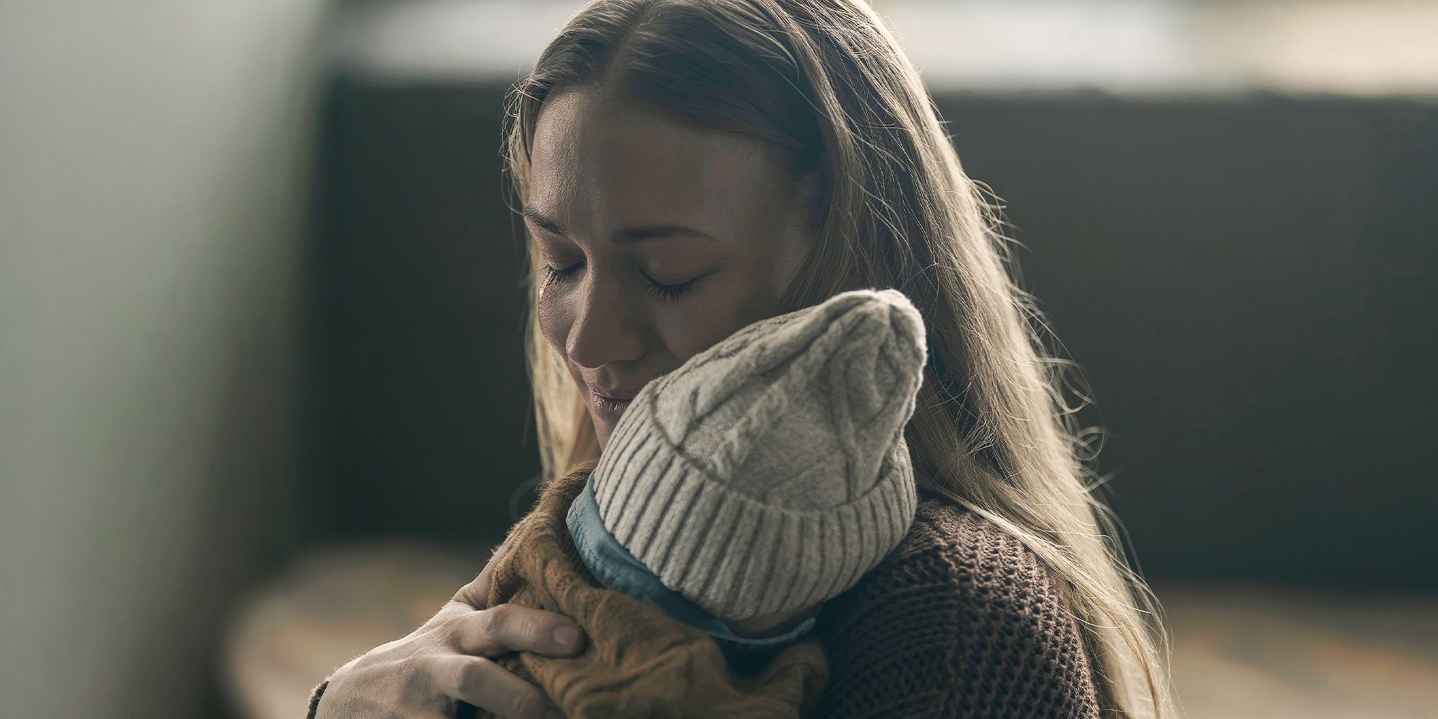 Yvonne Strahovski as Serena holding her baby in The Handmaid's Tale
