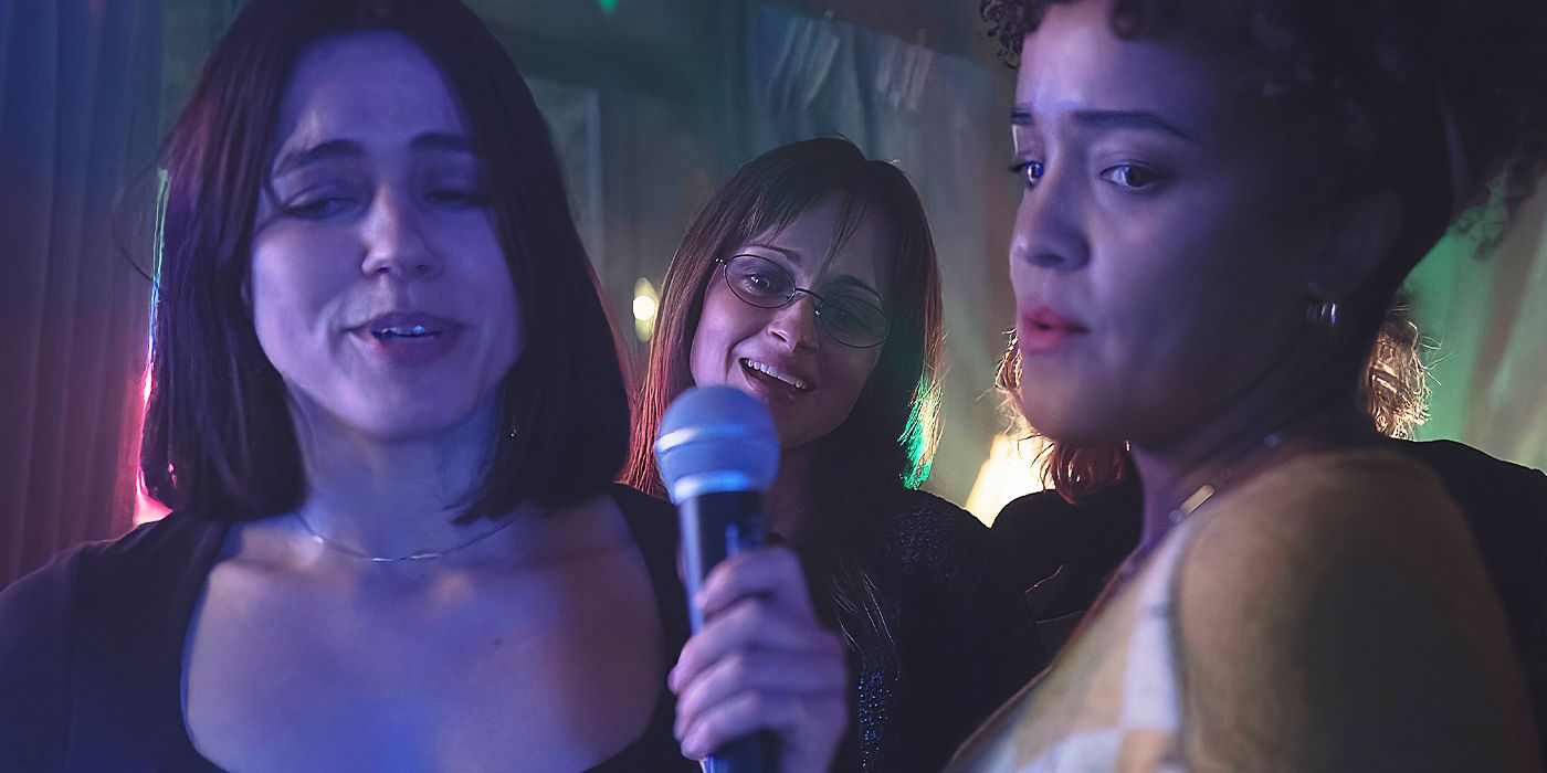 Nina Kiri as Alma, Alexis Bledel as Emily and Bahia Watson as Brianna singing karaoke in The Handmaid's Tale