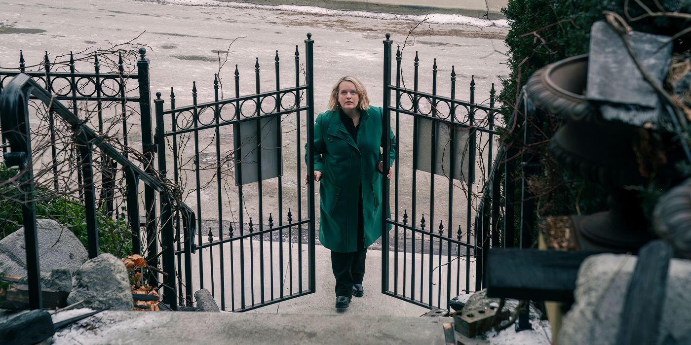 Elisabath Moss as June entering the gates of the Waterford house in The Handmaid's Tale.