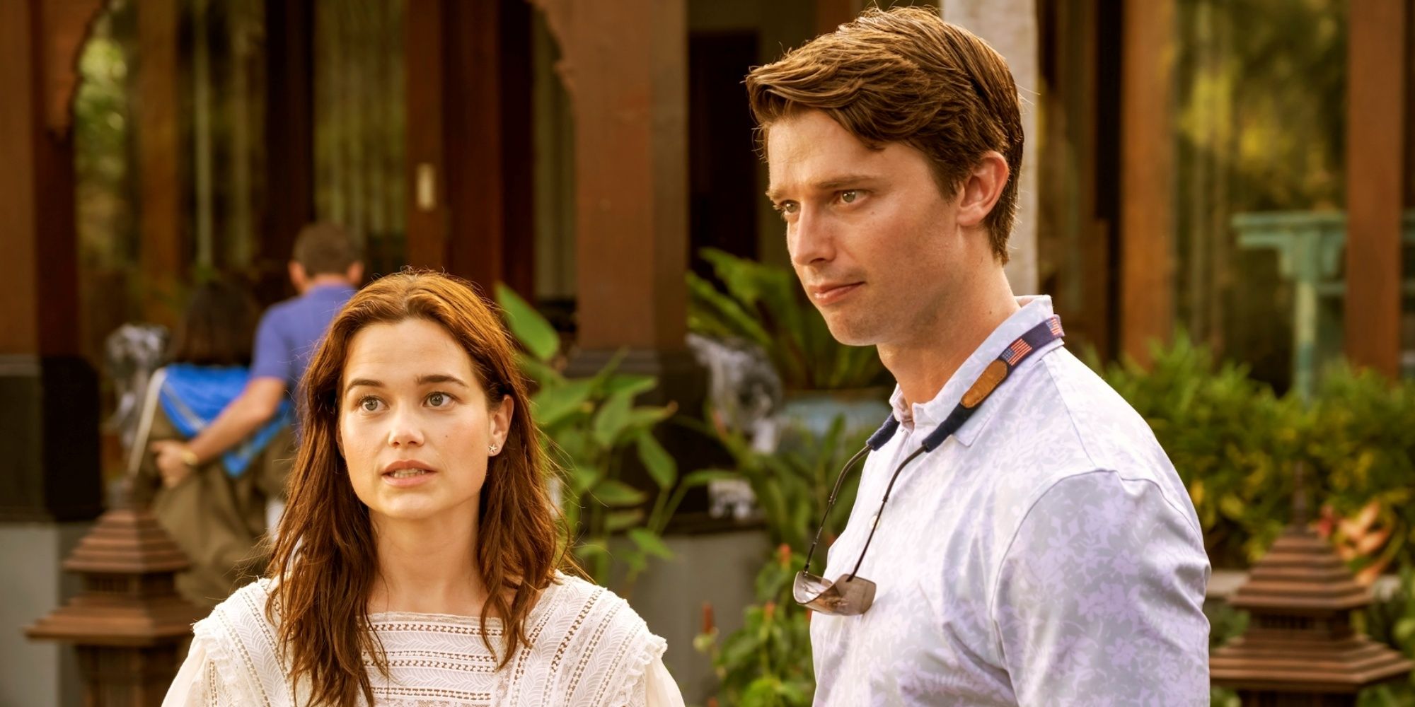 Patrick Schwarzenegger as Saxon standing outside next to Sarah Catherine Hook as Piper in The White Lotus
