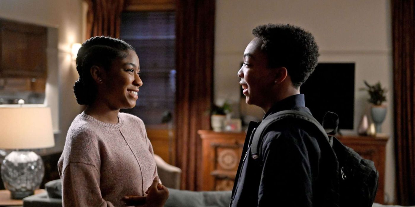 Deja and Malik smiling at one another after hanging out together in This Is Us.