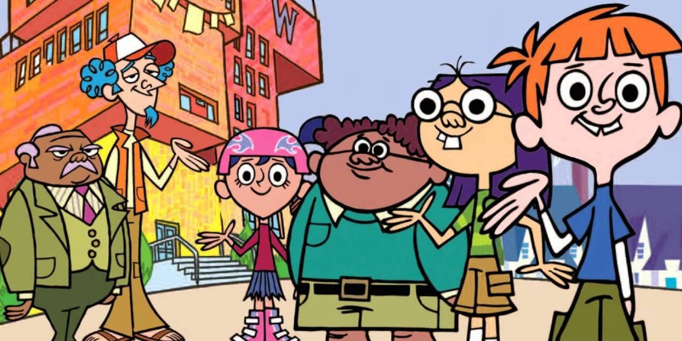 The cast of Wayside in front of a tall school