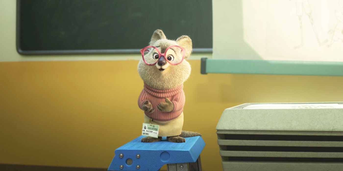 Dr. Fuzzby on a stool with little pink glasses and a sweater in Zootopia 2