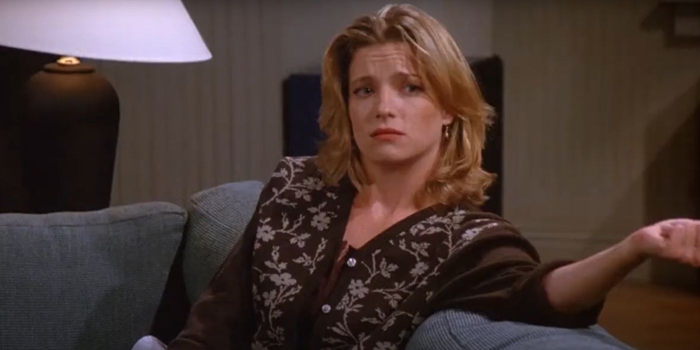 Angela Dohrmann, sitting on the couch, as Donna Chang in Season 6, Episode 4 of 'Seinfeld'.