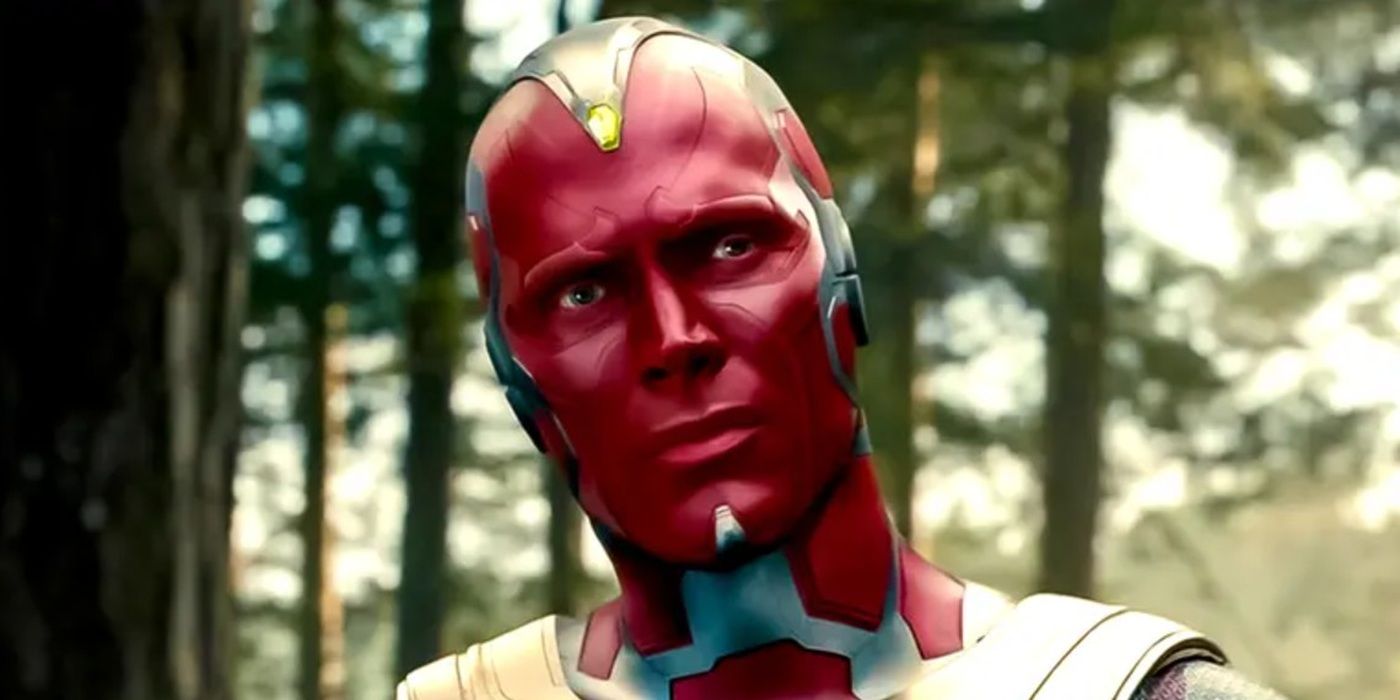 Paul Bettany as Vision in Avengers Age of Ultron looking to the side in a forest. 