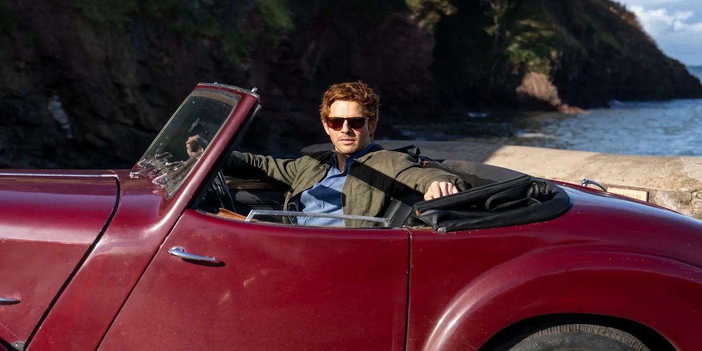 Damien Malony as Jim Bergarac in a car wearing sunglasses in Bergarac.