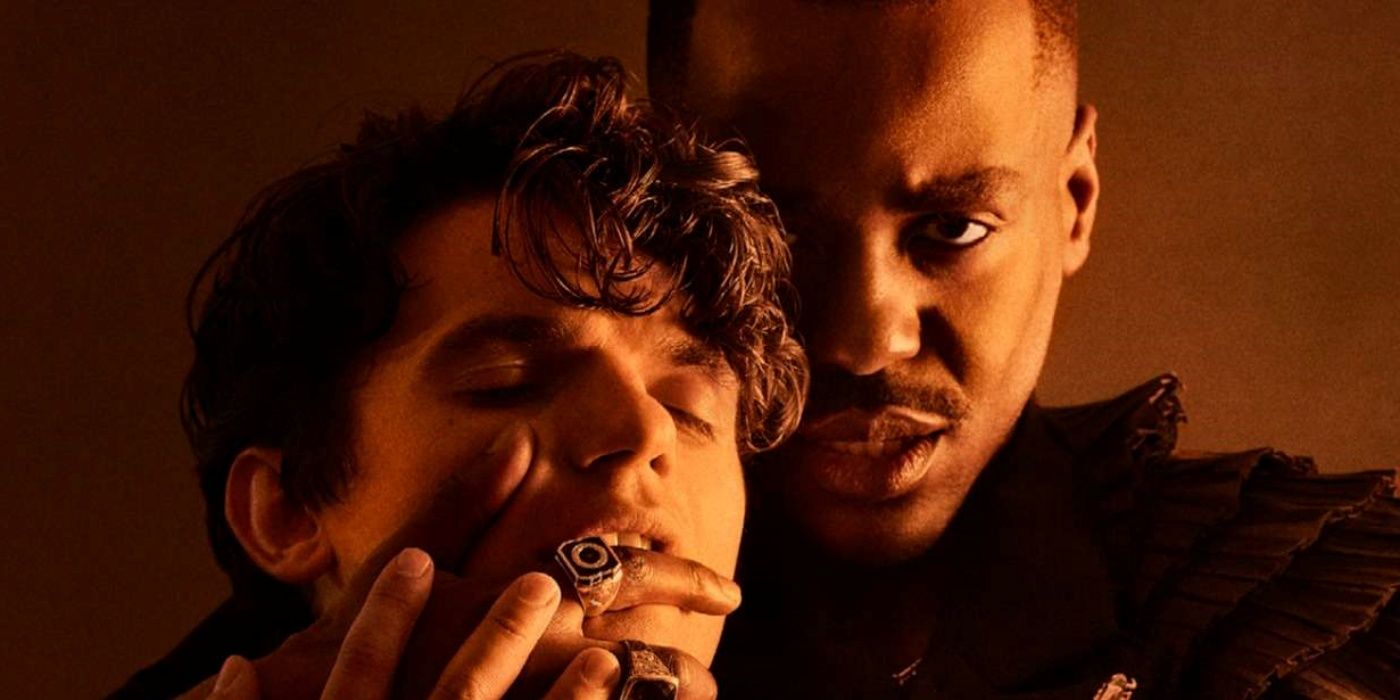 Ncuti Gatwa as Marlowe with his right hand in the mouth of Edward Bluemel as Shakespeare in Born with Teeth