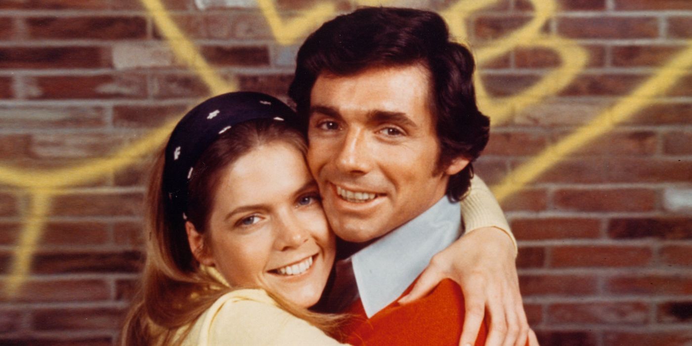 Meredith Baxter and David Birney hugging in front of a graffiti wall for Bridget Loves Bernie.