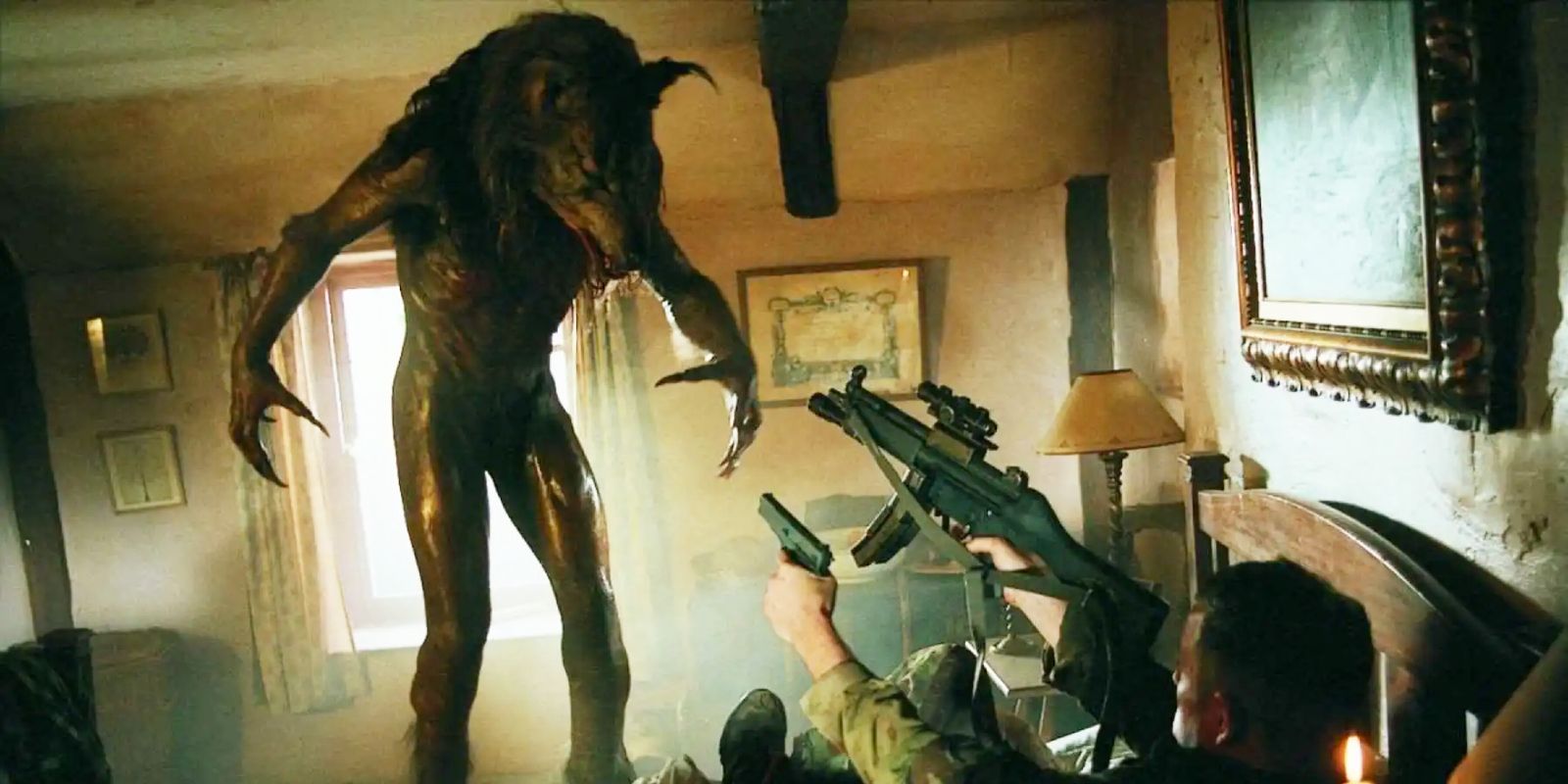A werewolf approaching a soldier pointing guns at it in Dog Soldiers (2002)
